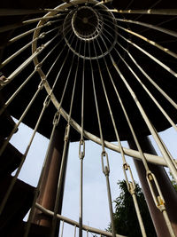 Low angle view of ferris wheel against building