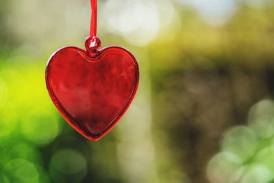 Close-up of red heart shaped pendant