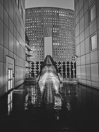 Reflection of illuminated buildings in city at night