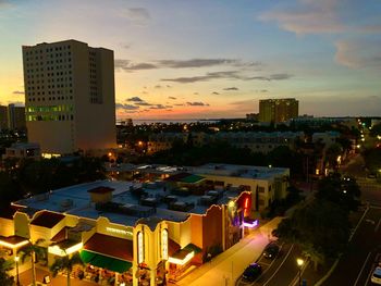 High angle view of illuminated buildings against sky at sunset