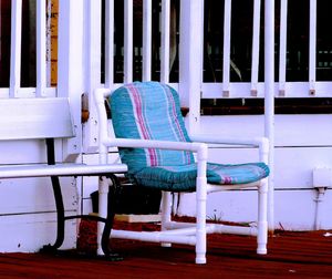 Empty chairs against blue wall