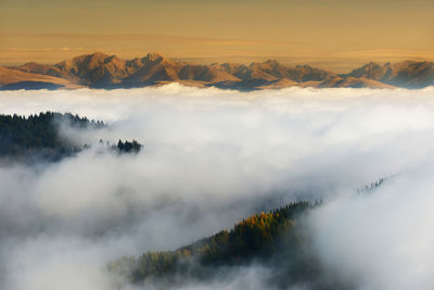 Scenic view of mountains against sky during sunset