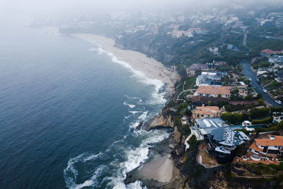 High angle view of buildings by sea