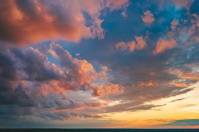 Low angle view of dramatic sky during sunset