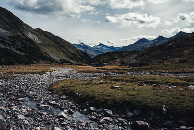 Scenic view of lake and mountains against sky