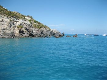 Scenic view of sea against clear blue sky