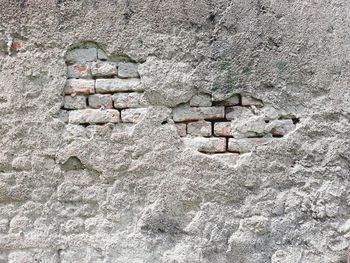 Low angle view of stone wall