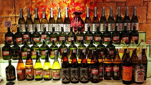 Close-up of wine bottles on display at market stall