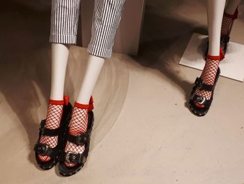 Low section of woman in high heels
