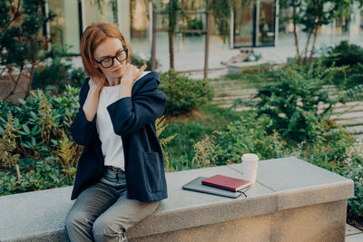 Portrait of young woman using mobile phone