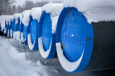 Close-up of text on snow covered landscape