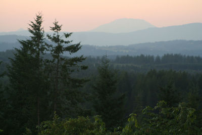 Scenic view of mountains against cloudy sky