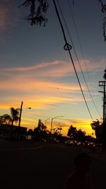 Cars on road at sunset