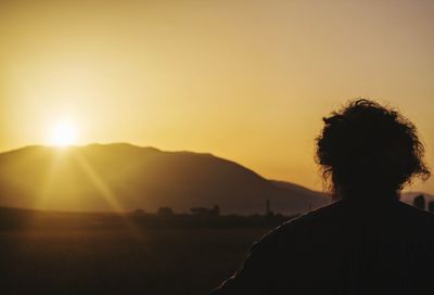 Silhouette of man at sunset