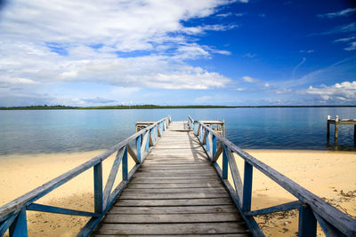 Pier over sea against sky