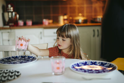 Girl setting table