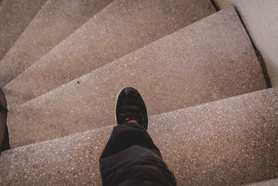 Low section of person standing on steps