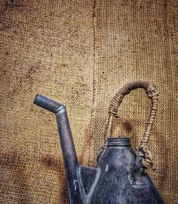 High angle view of old metal on wall