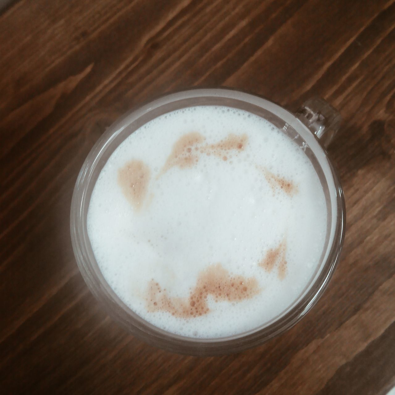 indoors, food and drink, drink, refreshment, table, freshness, still life, coffee cup, close-up, high angle view, directly above, frothy drink, wood - material, coffee - drink, no people, coffee, cappuccino, saucer, circle, drinking glass