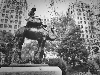 Statue in front of building