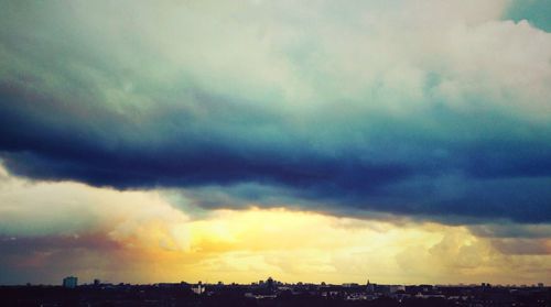 Dramatic sky over silhouette landscape