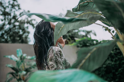 Rear view of woman with umbrella