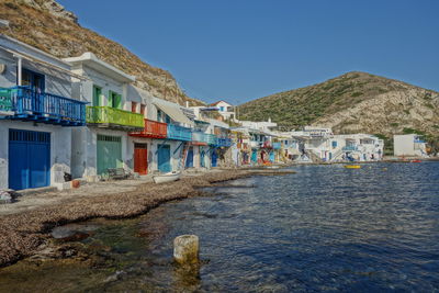 View of colorful picturesque fisher homes in milos greece