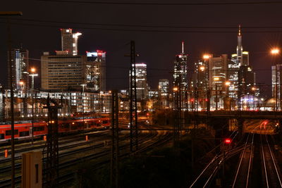 High angle view of railroad tracks at night