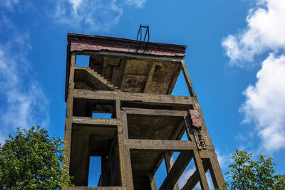 Low angle view of old tower against sky