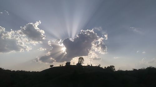 Low angle view of silhouette man against sky during sunset