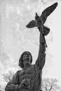 Low angle view of statue against sky