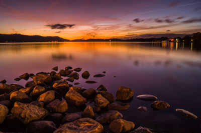 Scenic view of lake against sky during sunset