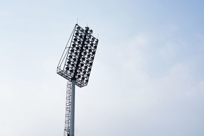 Low angle view of communications tower against sky