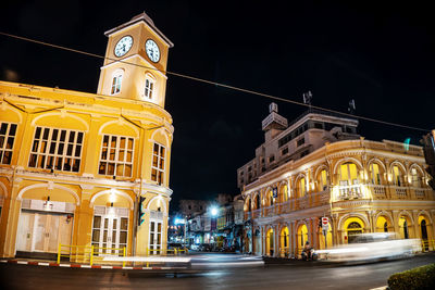 Illuminated building in city at night