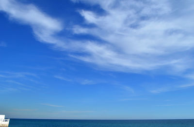 Scenic view of sea against blue sky