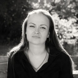 Portrait of smiling young woman standing outdoors