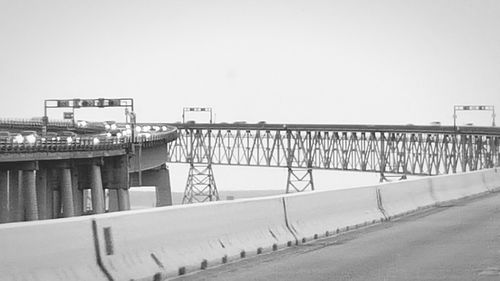 View of bridge in city against clear sky