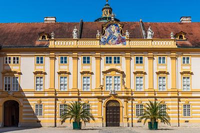 Facade of building against clear sky