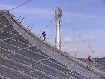 Silhouette of woman against cloudy sky