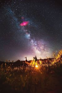Scenic view of landscape against sky at night
