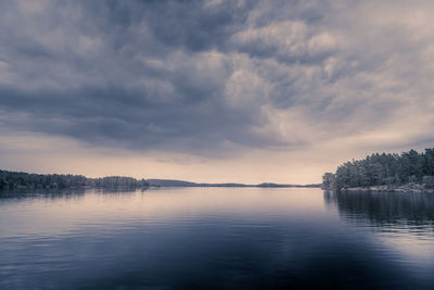 Scenic view of lake against sky during sunset