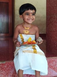 Portrait of smiling girl holding ice cream