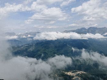 Aerial view of clouds over mountain