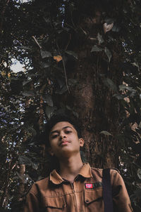 Portrait of young man looking up