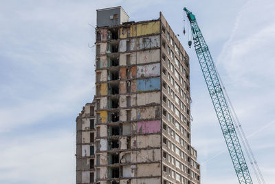 Tower block being demolished