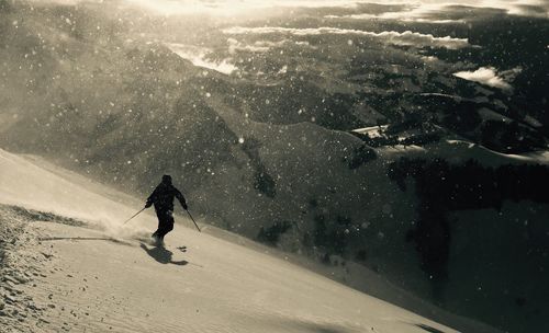 Man skiing on snowcapped mountain