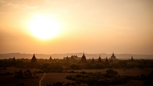 Panoramic view of silhouette landscape against sky during sunset