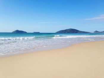 Scenic view of beach against clear sky