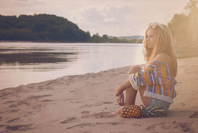 Woman sitting on beach