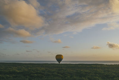 Hot air balloons against sky during sunset